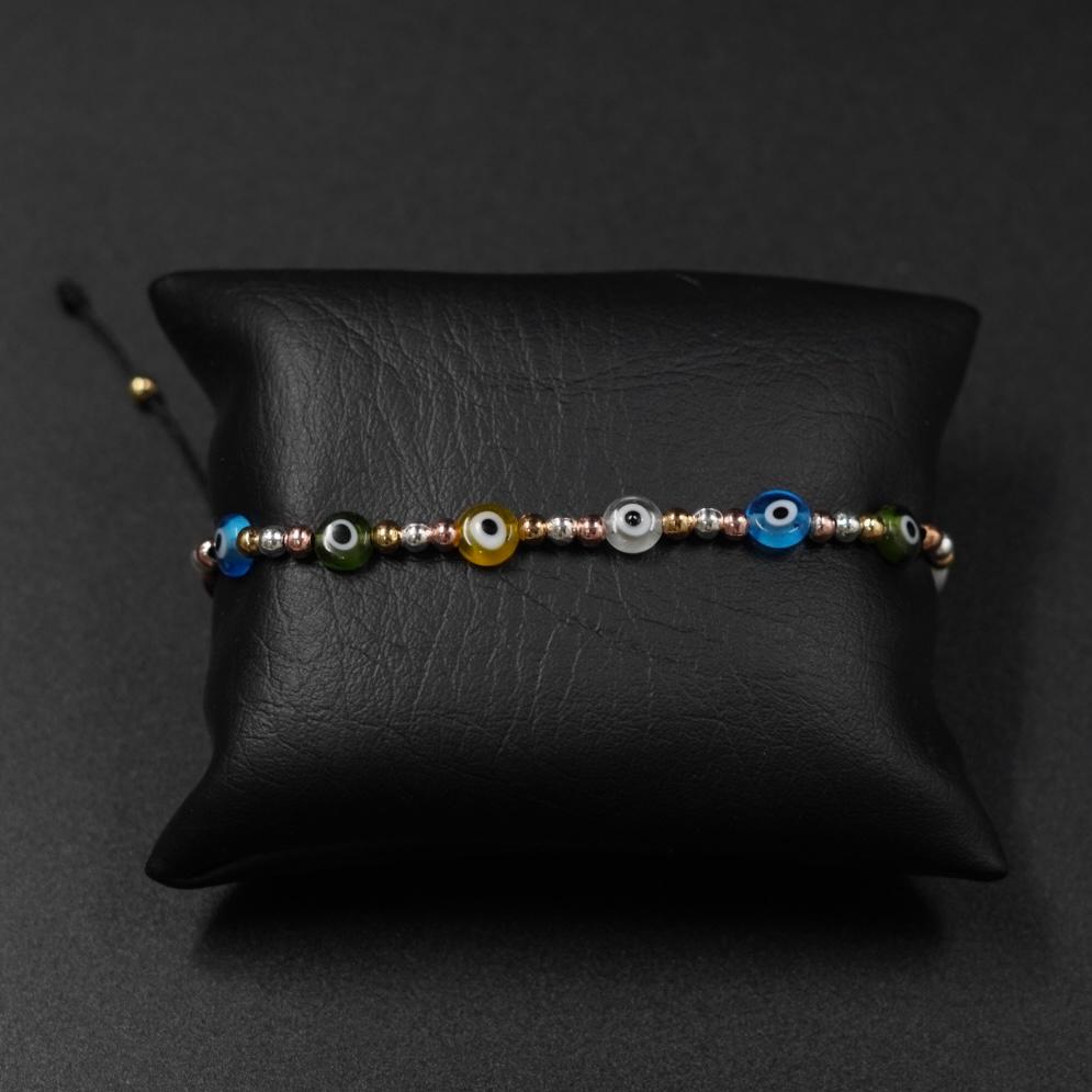 TOBILLERA OJOS PROTECCIÓN RODIO 3 OROS